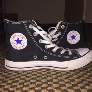 Black High-top Converse.