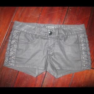Black stretch shorts with lace up details on sides
