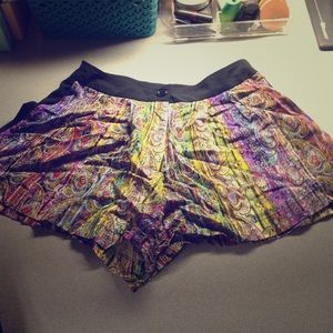 Tight at the hips but flows out really roomy!