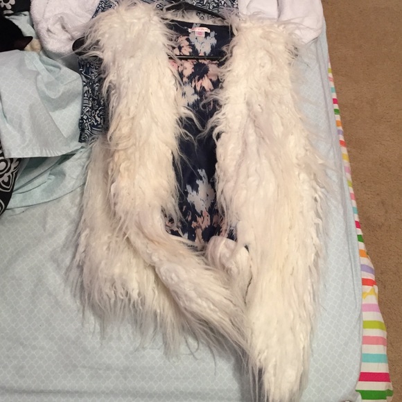 White fur vest
