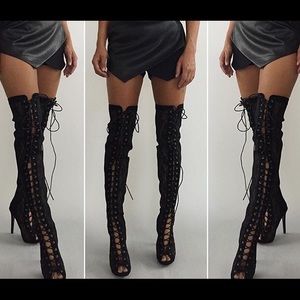 Brand New lace up thigh high boots. Never worn!