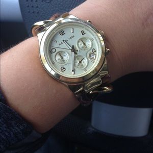 Michael Kors gold and tortoise chain watch.