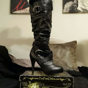 High heeled knee high boots