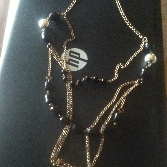 Layered gold and black necklace