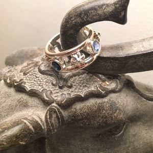 Silver ring with blue stones and flowers