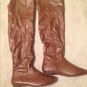 Tan colored over- the knee boot. Only worn once.