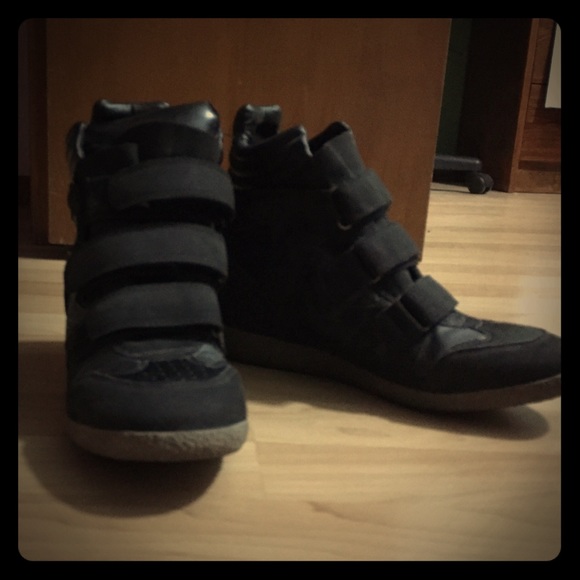 Black heeled high top boots