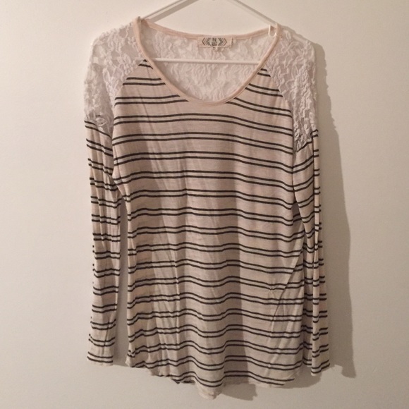 BLUE AND WHITE STRIPPED SHIRT.