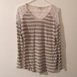 BLUE AND WHITE STRIPPED SHIRT.