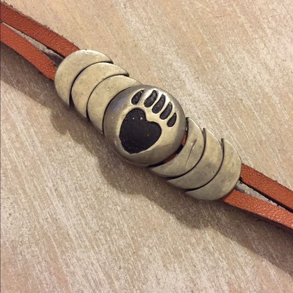 Leather and silver bear paw bracelet.