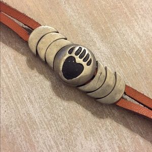 Leather and silver bear paw bracelet.