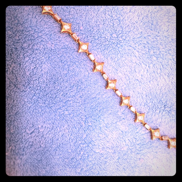 Gold plated bracelet with crystals.