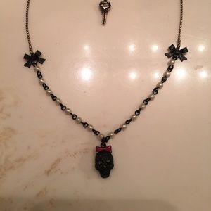 Betsy Johnson, black sugar skull bow necklace.