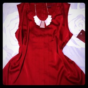 Elegant and silky sleeveless top, new with tags.