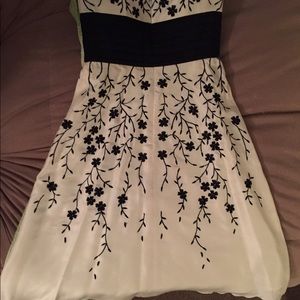 Cream and black short dress.