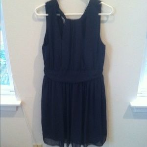 Grecian neck, navy bridesmaid type dress.
