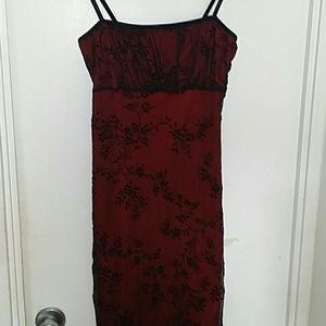 Red fitted dress with black lace overlay