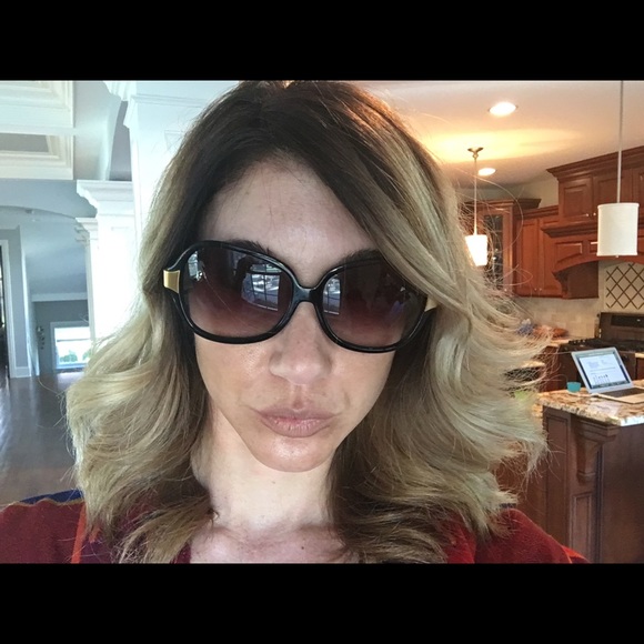 Oliver People's black and gold sunglasses.