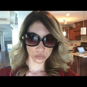 Oliver People's black and gold sunglasses.