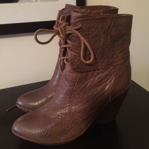 Reposhing Brown leather wedge boots.