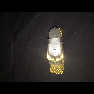 Gold tone and leather like bracelet