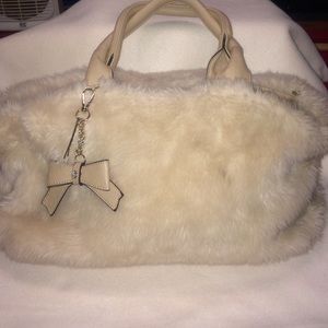 Furry cream colored purse