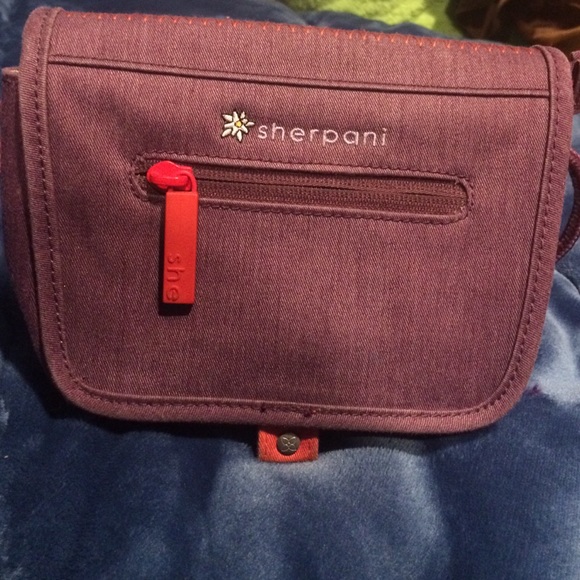 Cross the body purple sherpani purse