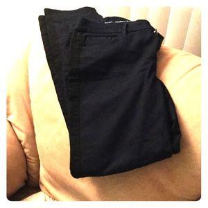 Dark colored jeans with black stripe on the sides