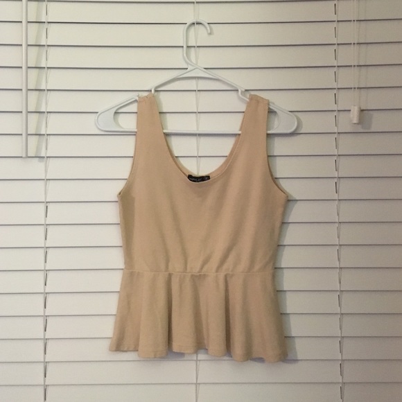 Cream colored peplum top. Make an offer :)