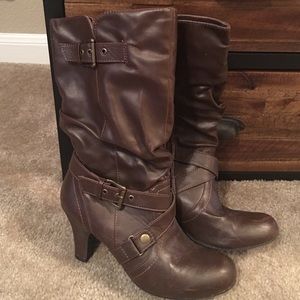 Brown, zip up boots with buckles.