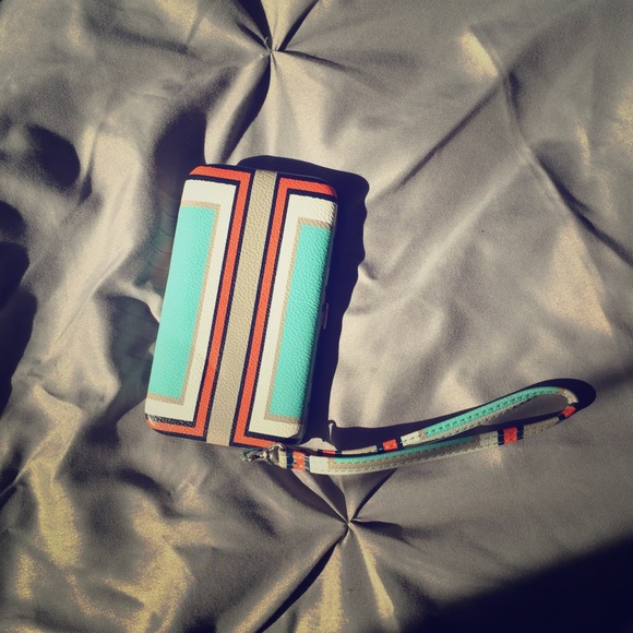 Wristlet phone carrier and wallet.