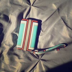 Wristlet phone carrier and wallet.