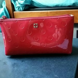 Red Kate Spade cosmetic bag.