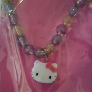 Hello Kitty pendant with colorful necklace.