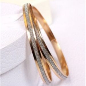 2 stunning gold plated bracelets....