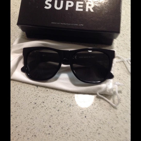 Adorable black sunglasses from Neiman Marcus. New.