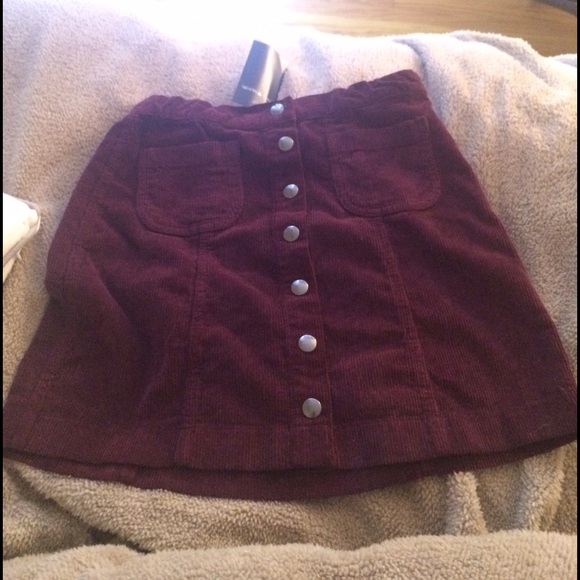 Red corduroy button front skirt