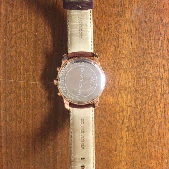 MK rose gold watch with brown leather band