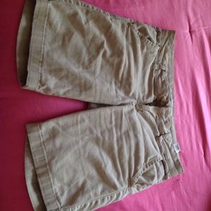 khaki shorts; finger tip length