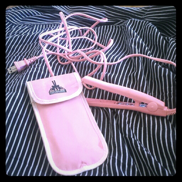 Mini pink straighten iron with case.