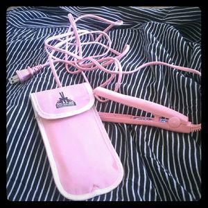 Mini pink straighten iron with case.