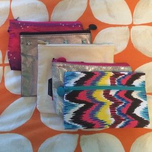 FIVE small ipsy cosmetic bags!