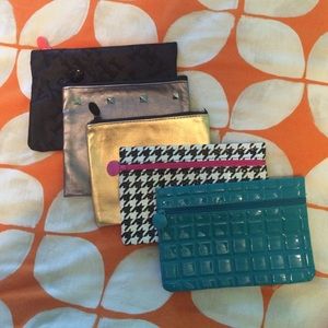 FIVE small zipper pouches!