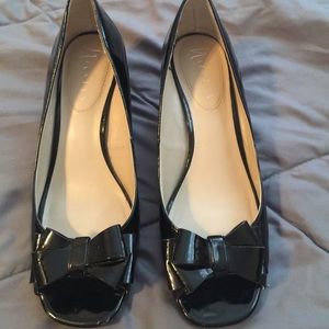 Cute black low heels with bow.