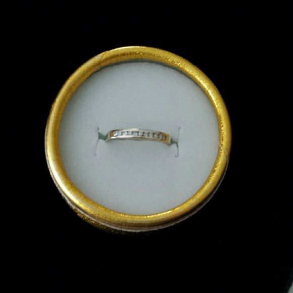 Jewelry - Diamond ring with eleven tiny diamonds.