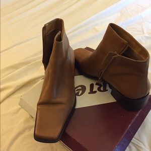 Brown leather boots and red shirt