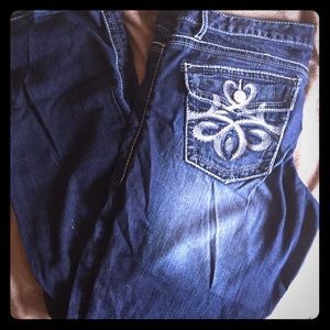 Dark washed distressed Maurice's jeans
