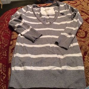 Gray and white striped v neck sweater