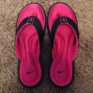 Pink Nike Flip Flops.