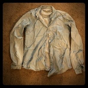 Light blue button down shirt.